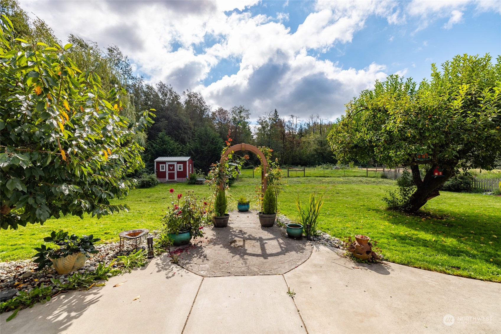 23610 Hoogdal Road Sedro-Woolley, WA 98284 - Photo 13 of 39 a view of a garden with lawn chairs