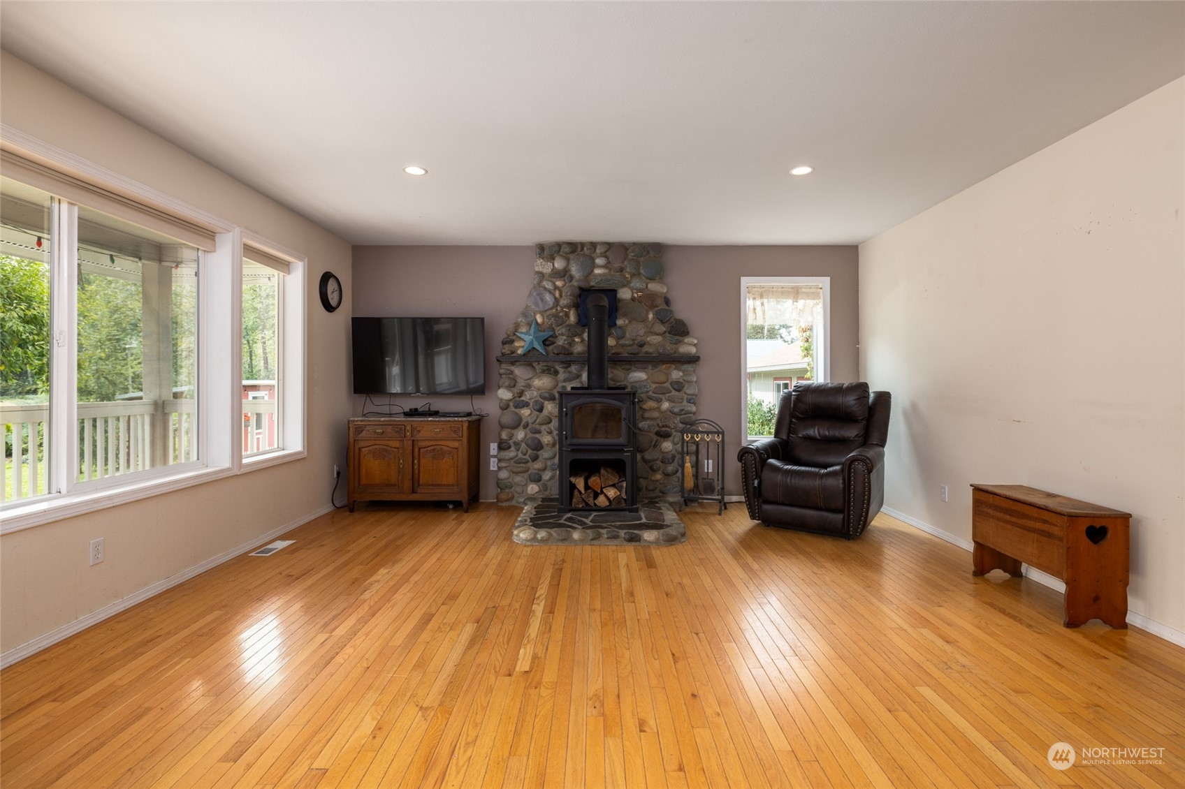 23610 Hoogdal Road Sedro-Woolley, WA 98284 - Photo 19 of 39 a living room with furniture and a fireplace