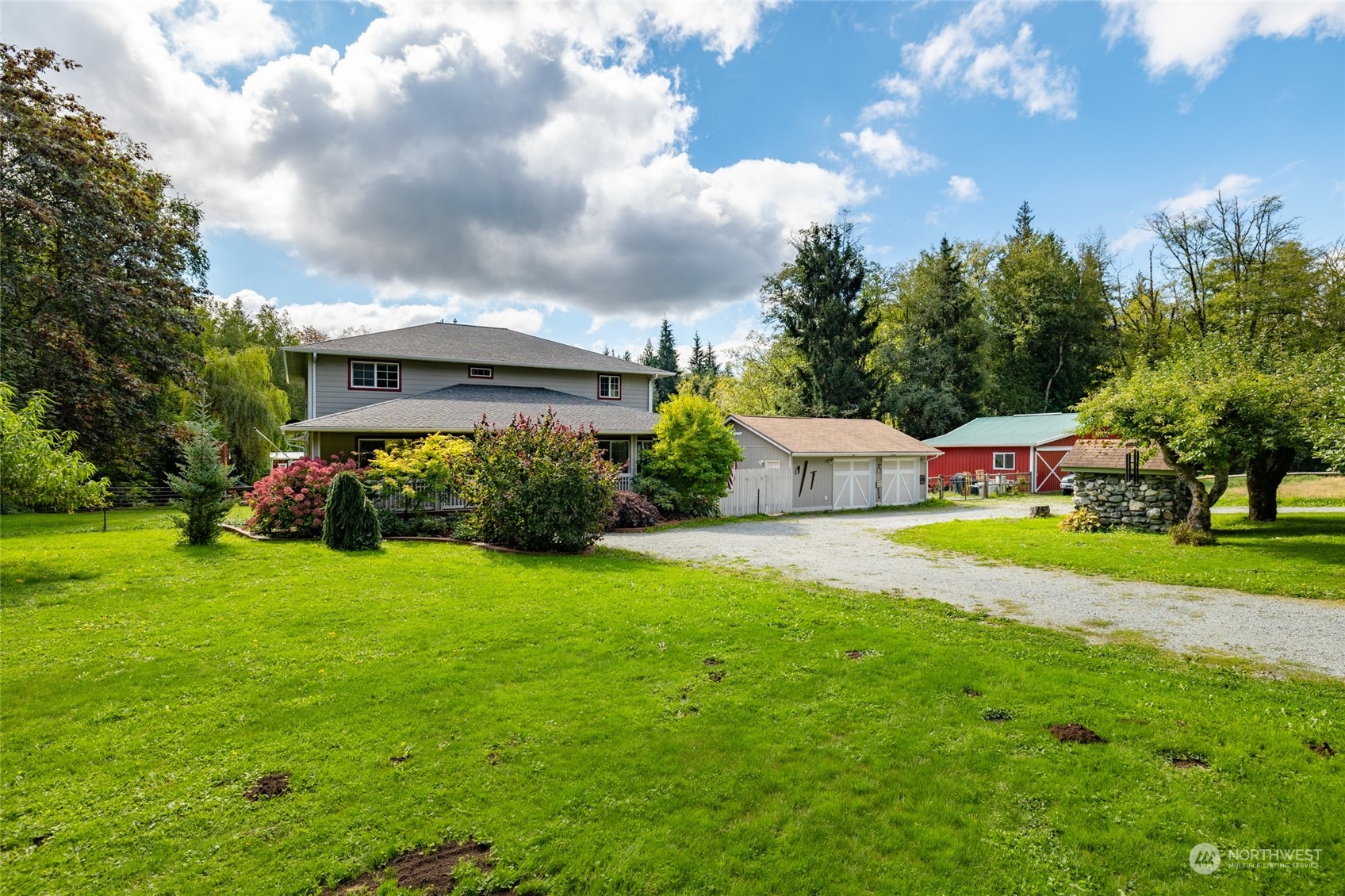 23610 Hoogdal Road Sedro-Woolley, WA 98284 - Photo 2 of 39 a front view of a house with garden