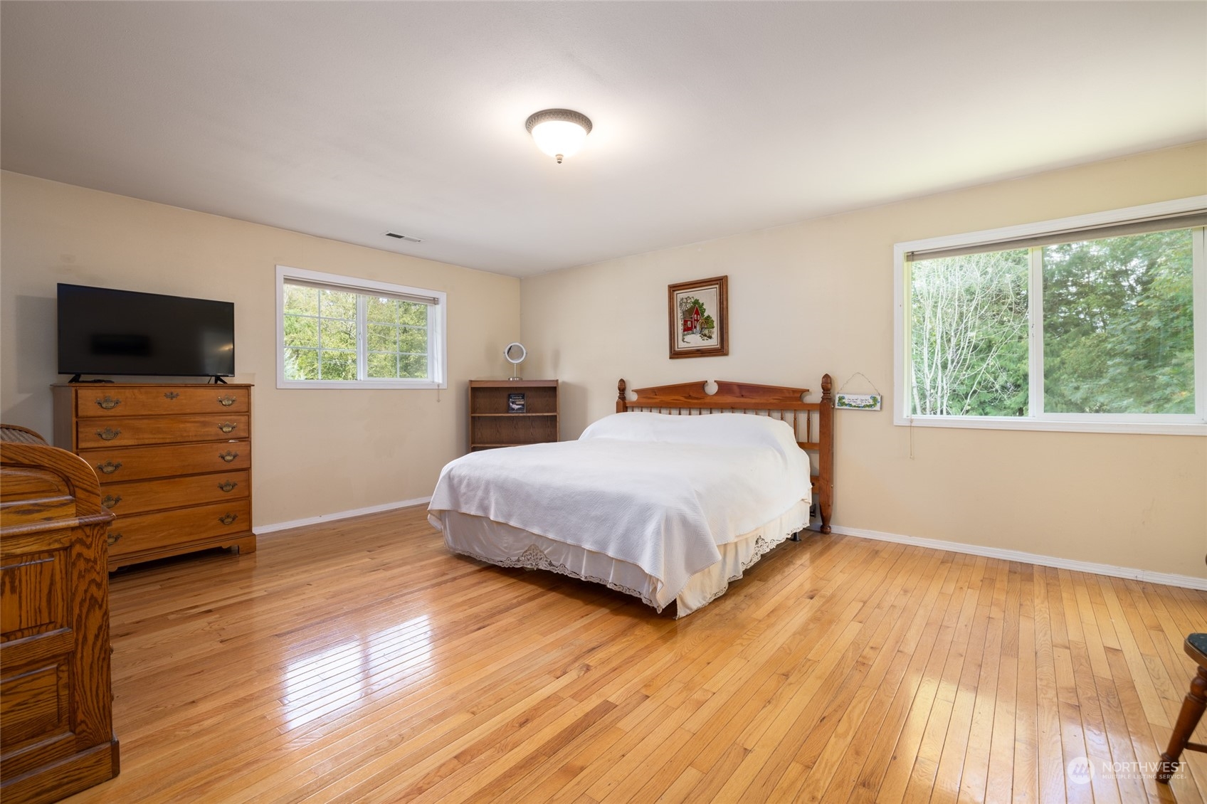 23610 Hoogdal Road Sedro-Woolley, WA 98284 - Photo 27 of 39 a bedroom with a bed and wooden floor