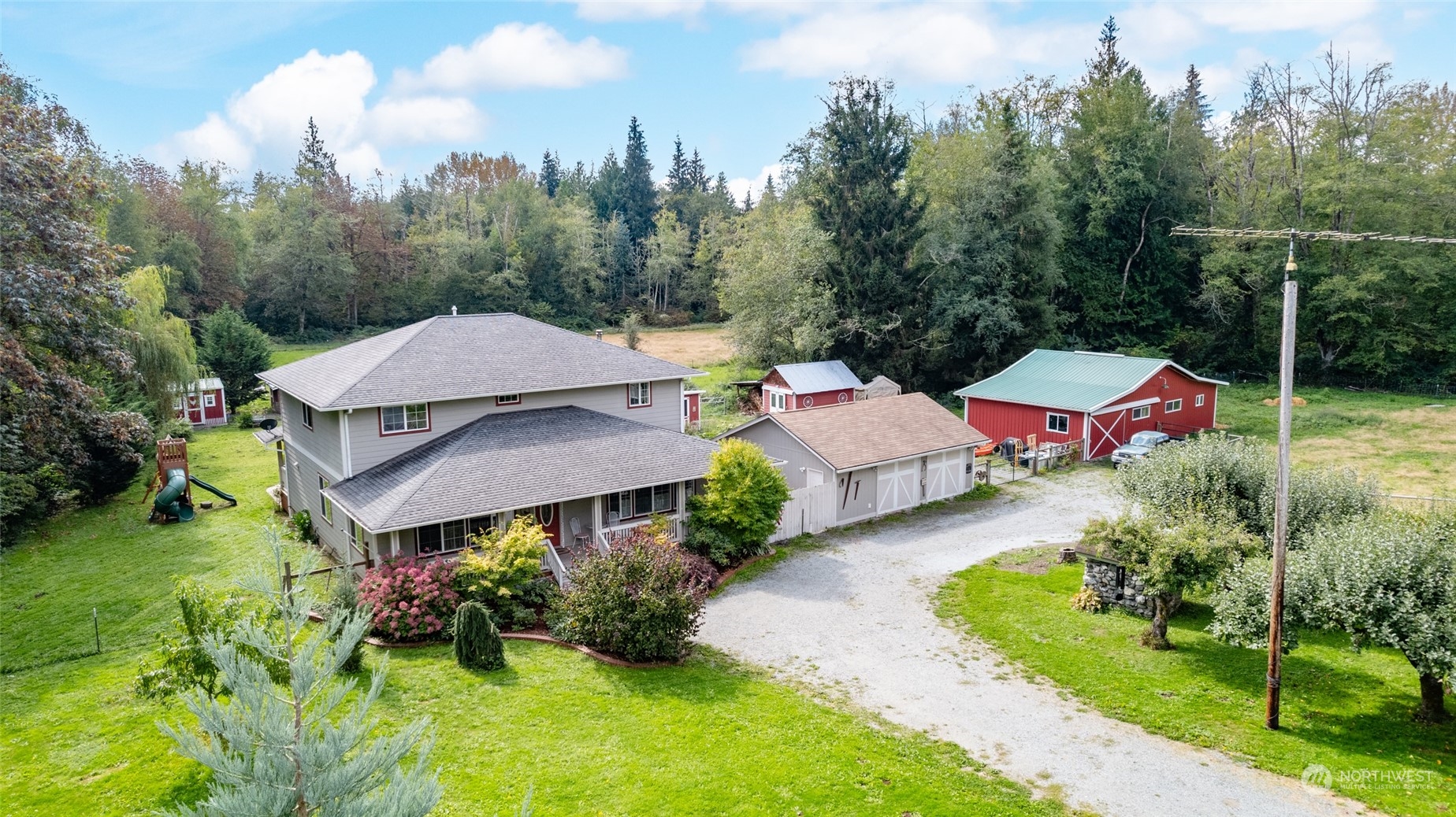 23610 Hoogdal Road Sedro-Woolley, WA 98284 - Photo 5 of 39 a view of a house with pool and garden