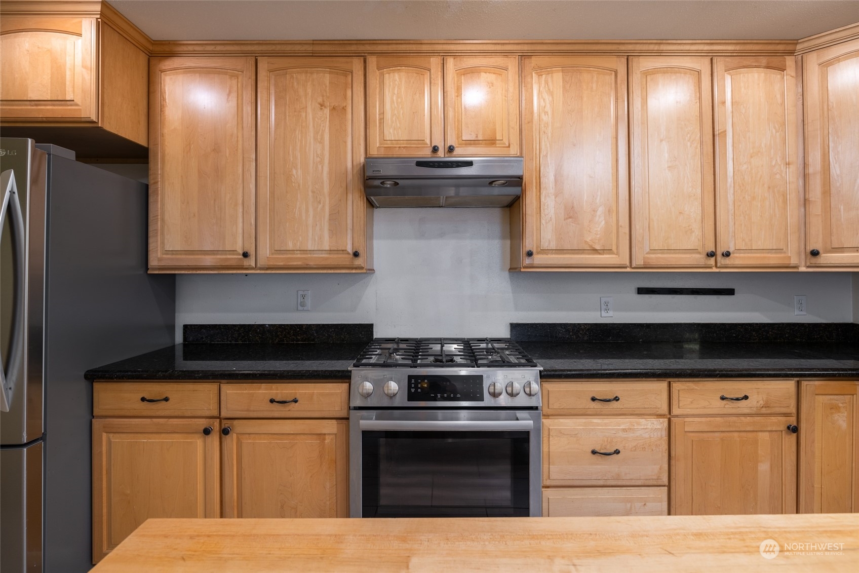 23610 Hoogdal Road Sedro-Woolley, WA 98284 - Photo 8 of 39 a kitchen with stainless steel appliances granite countertop a stove a sink and a refrigerator