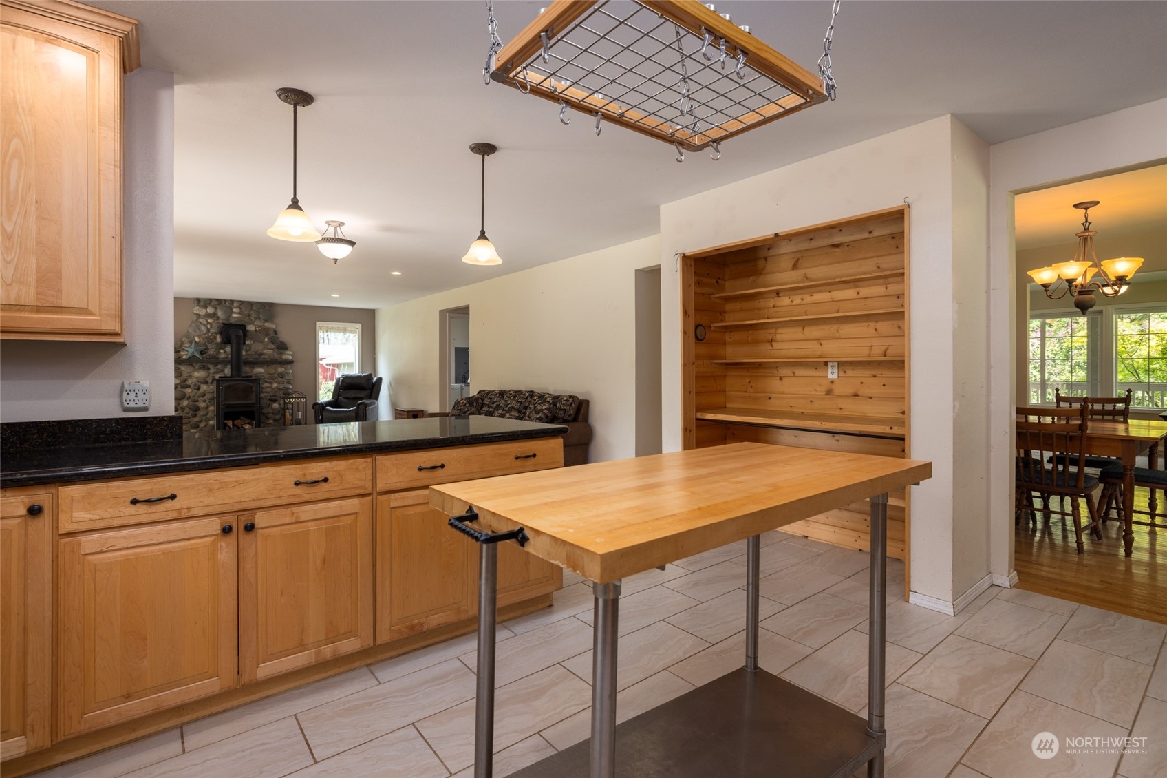 23610 Hoogdal Road Sedro-Woolley, WA 98284 - Photo 9 of 39 a kitchen with stainless steel appliances kitchen island granite countertop a table chairs and a refrigerator