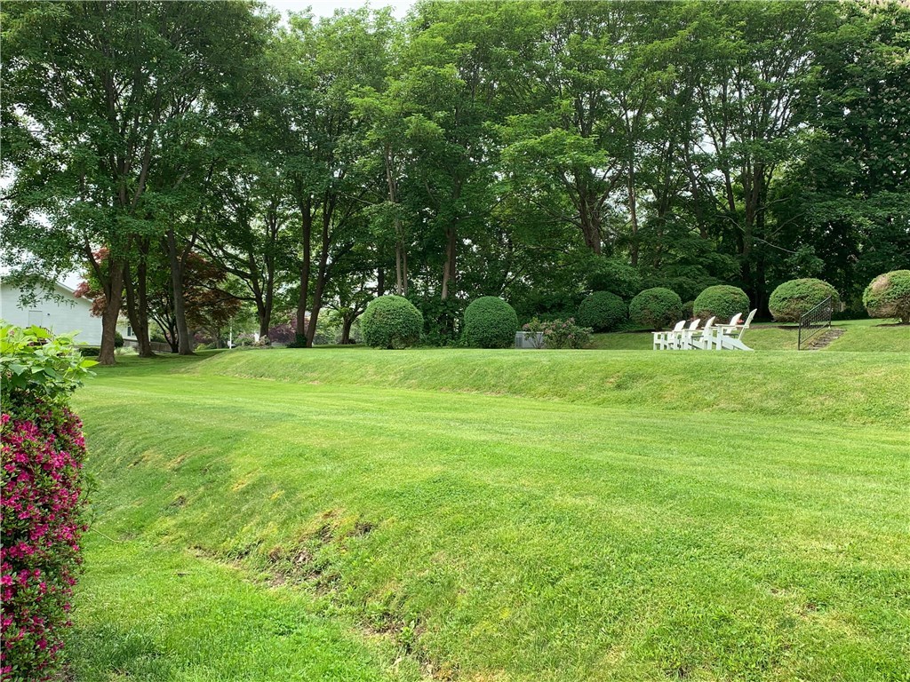 44 Bliss Mine Road, Unit 3 Middletown, RI 02842 - Photo 28 of 35 Southeast side of property. Relax on the Adirondack chairs