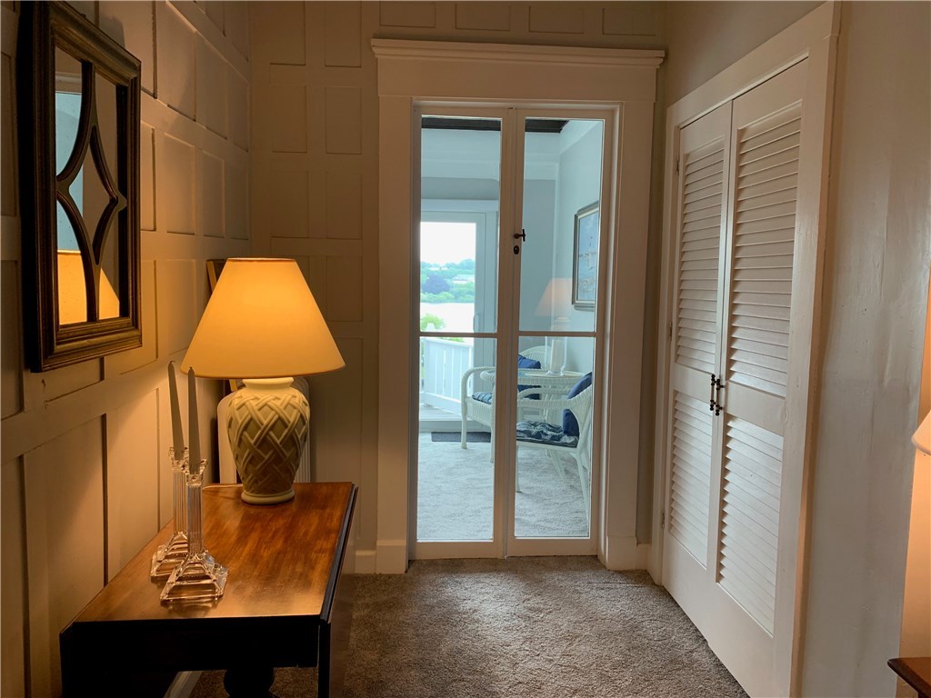 44 Bliss Mine Road, Unit 3 Middletown, RI 02842 - Photo 8 of 35 Living Room glass door to heated Sun Room