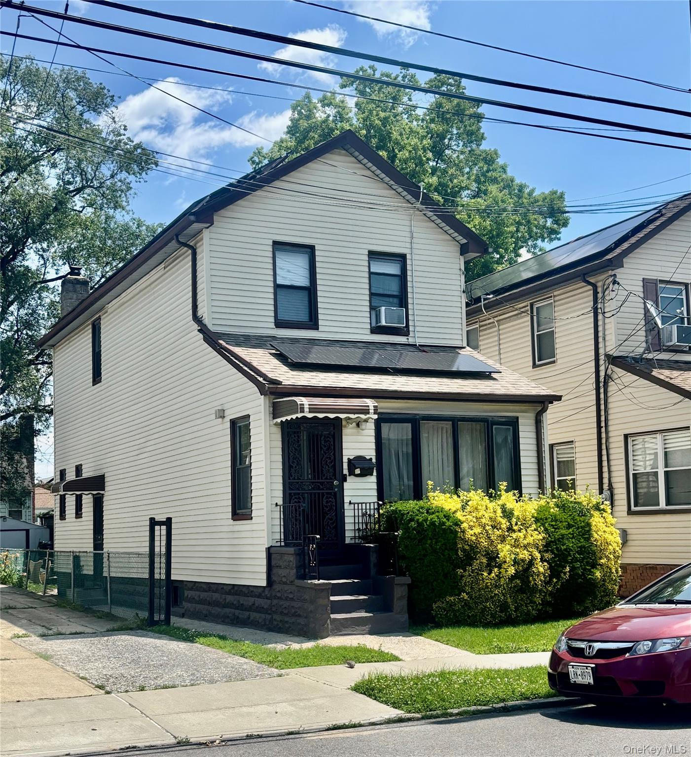 121-33 Grayson Street Queens, NY 11413 - Photo 1 of 1 a front view of a house with a yard