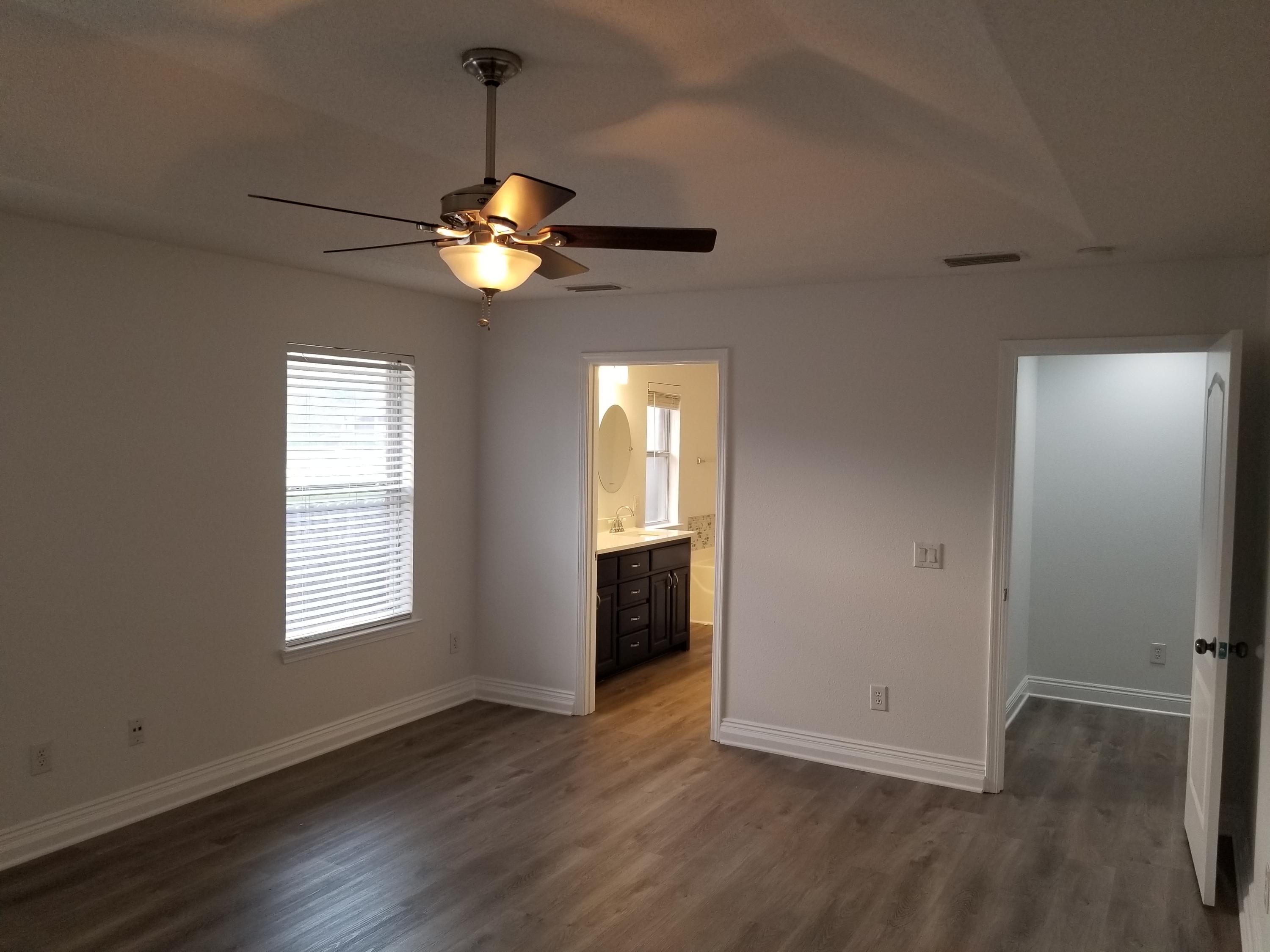 6673 Redfield Street Navarre, FL 32566 - Photo 18 of 32 a view of an empty room with a window