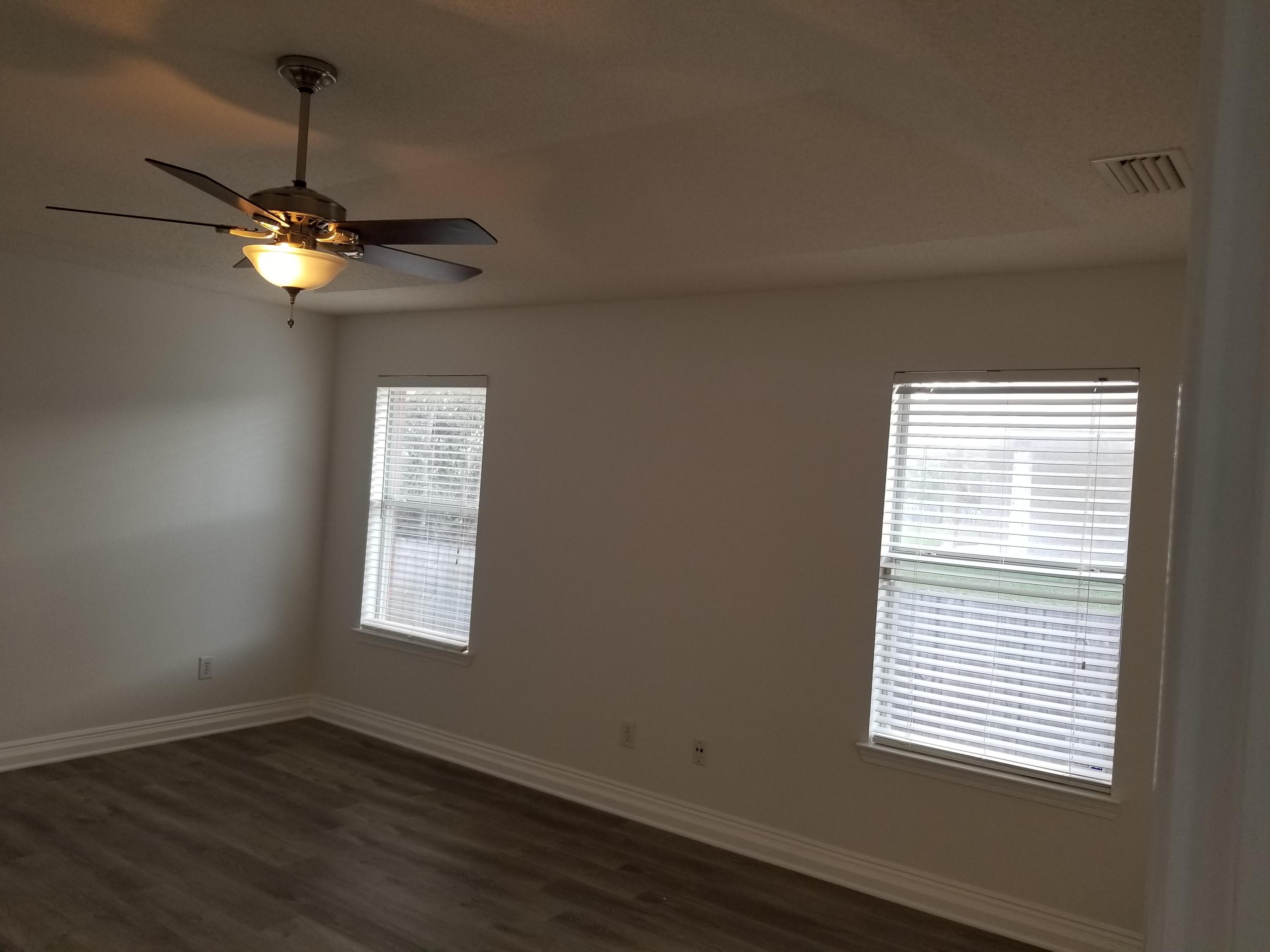 6673 Redfield Street Navarre, FL 32566 - Photo 19 of 32 a view of an empty room with a window