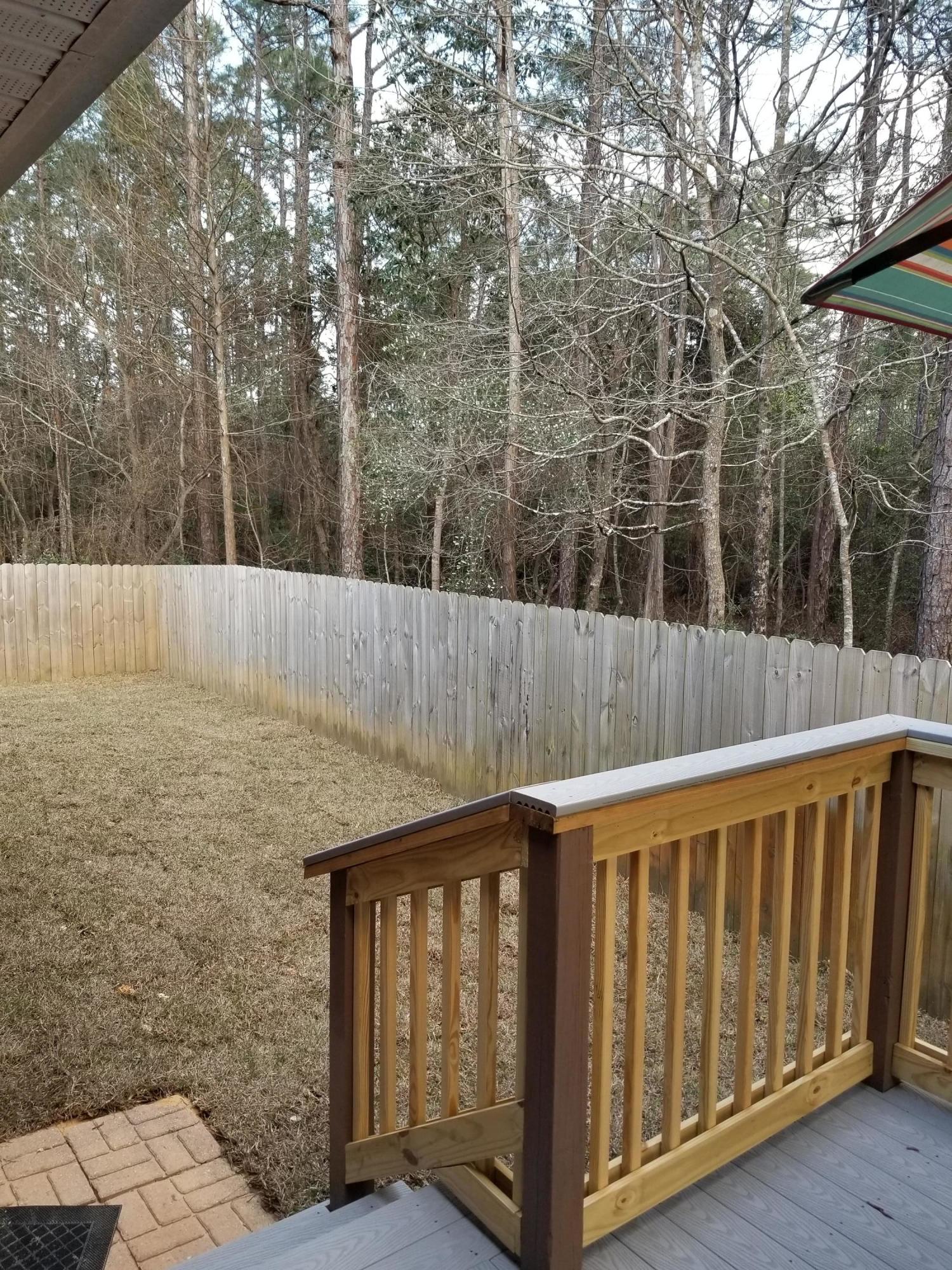 6673 Redfield Street Navarre, FL 32566 - Photo 30 of 32 a view of outdoor space and yard