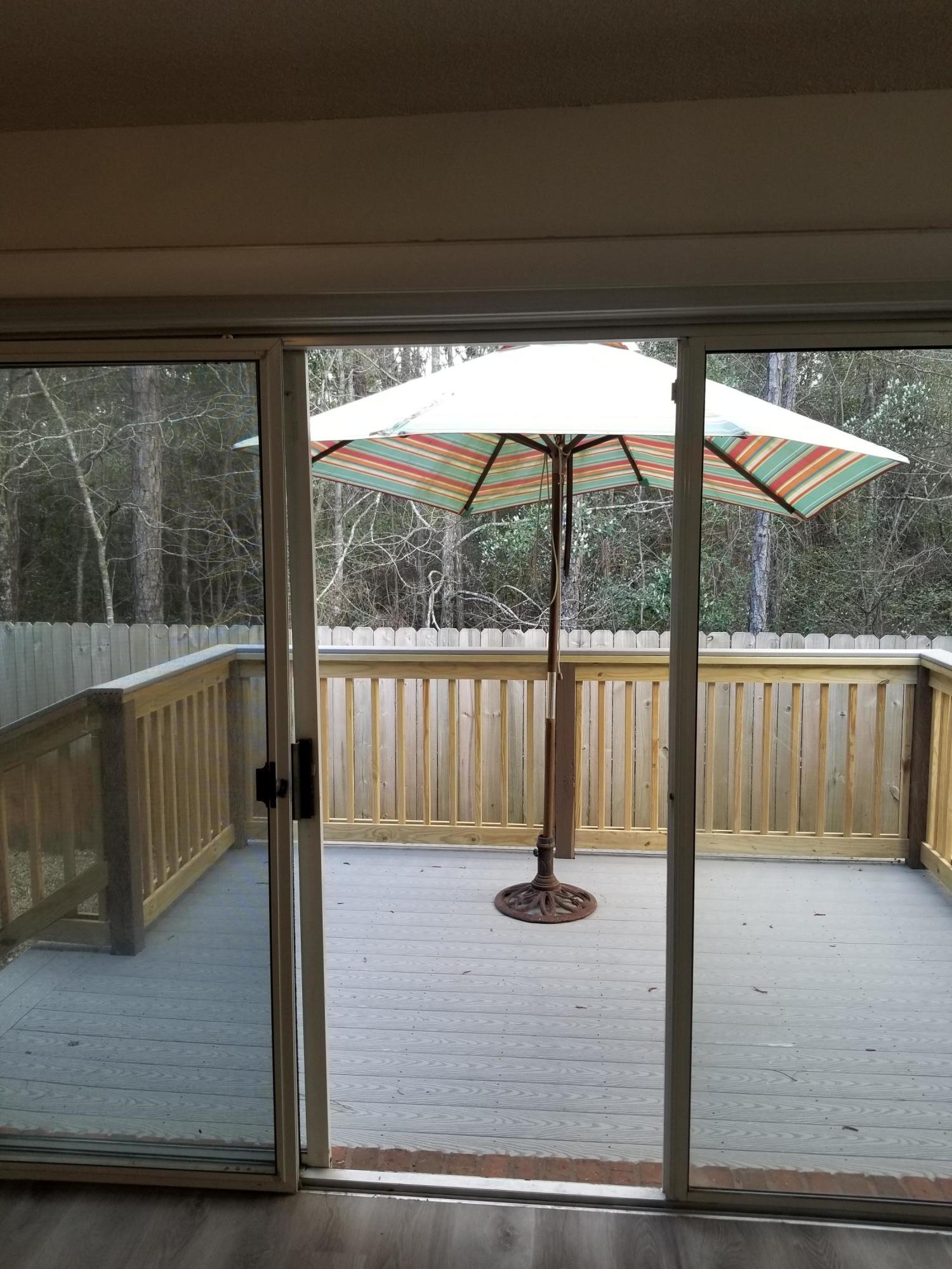 6673 Redfield Street Navarre, FL 32566 - Photo 32 of 32 a view of a floor to ceiling window