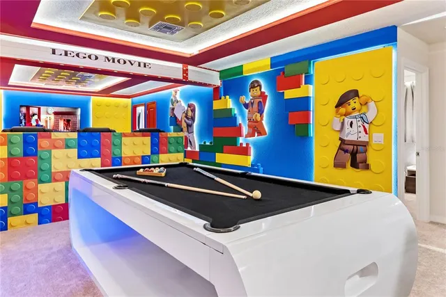 an aerial view of a house with yard swimming pool and outdoor seating