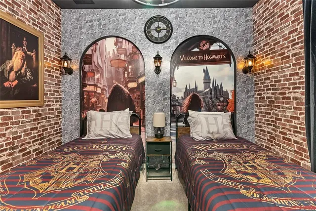 a kitchen with stainless steel appliances granite countertop a stove top oven a sink a dining table and chairs