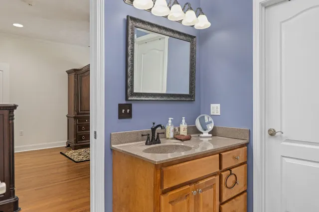 a bathroom with a sink a vanity and a mirror
