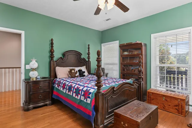 a bedroom with a bed and window