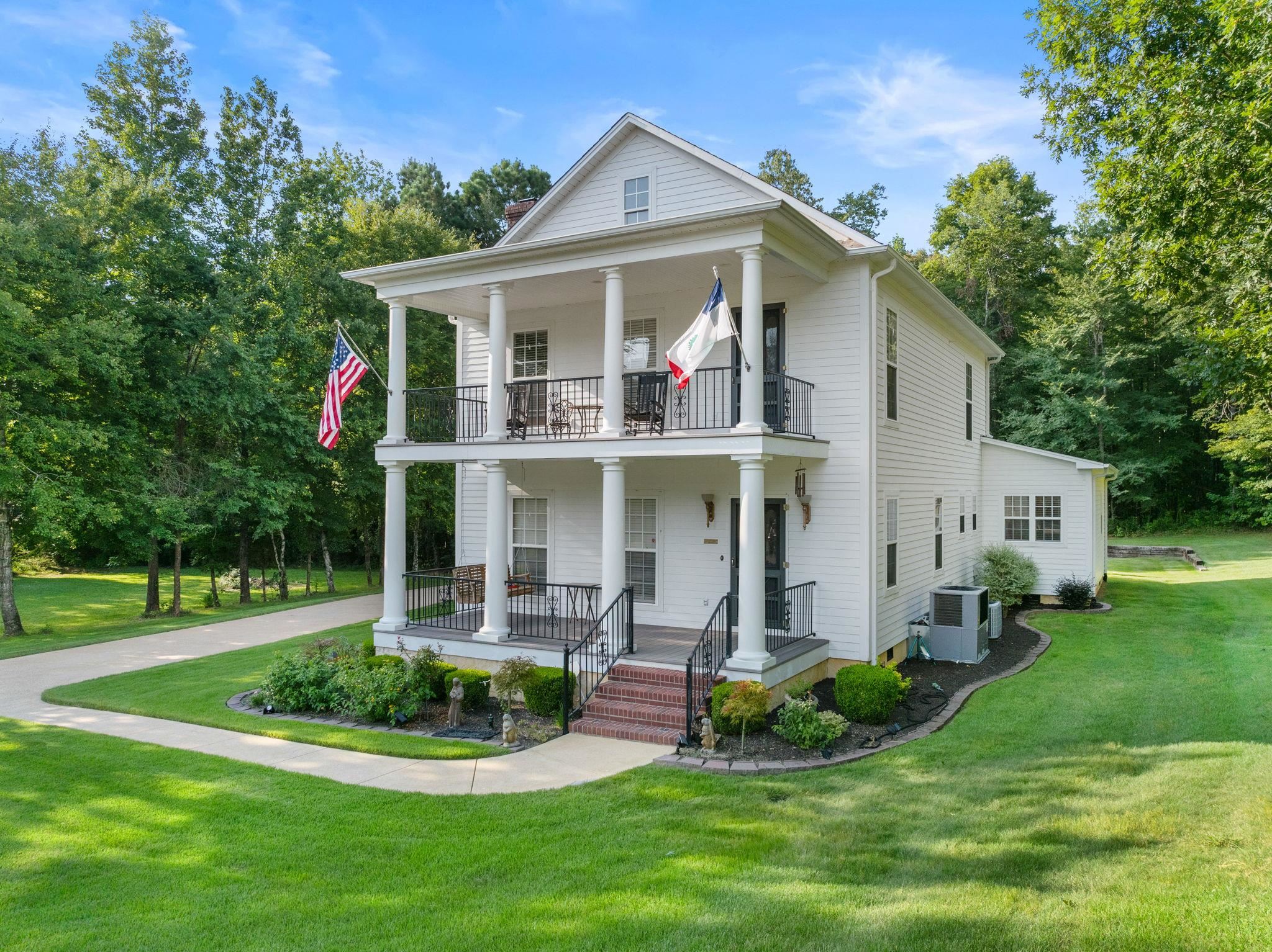 20 Tadpole Lane Corinth, MS 38834 - Photo 21 of 38 a front view of a house with a yard table and chairs