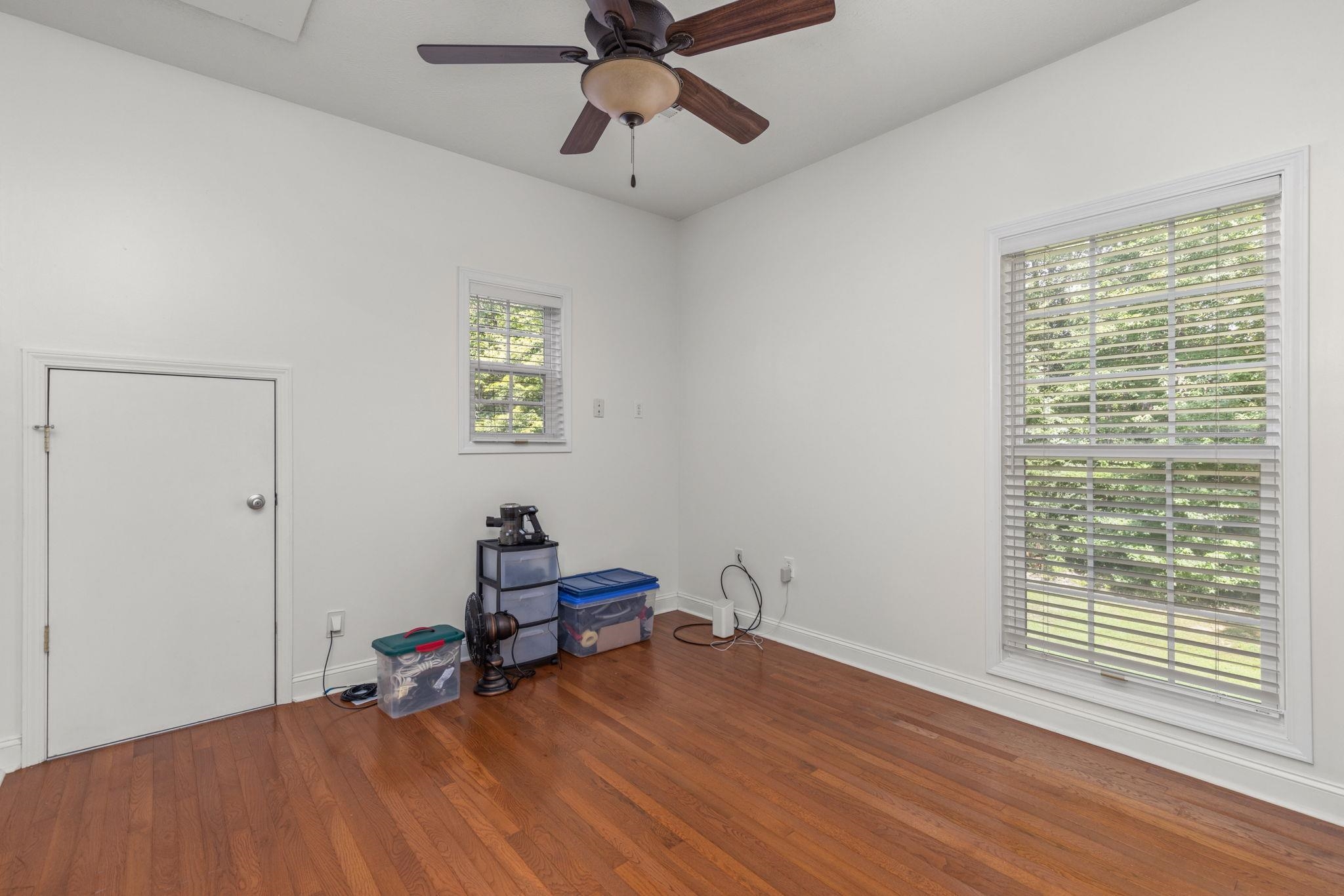 20 Tadpole Lane Corinth, MS 38834 - Photo 24 of 38 a room with window a ceiling fan and wooden floor