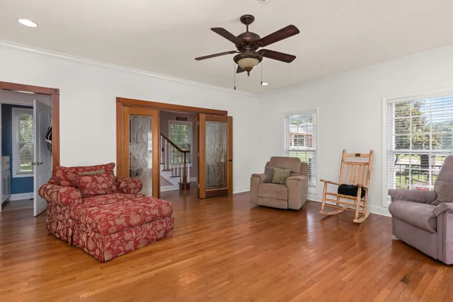 a living room with furniture and a large window