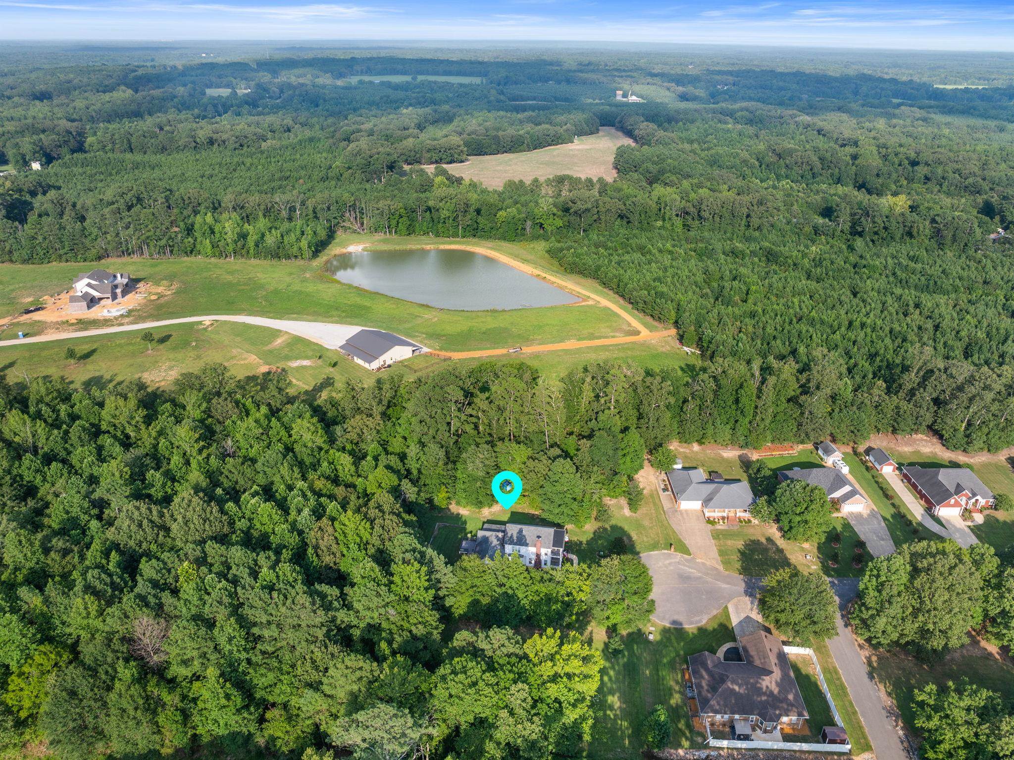 20 Tadpole Lane Corinth, MS 38834 - Photo 32 of 38 an aerial view of a house with pool plants and large trees