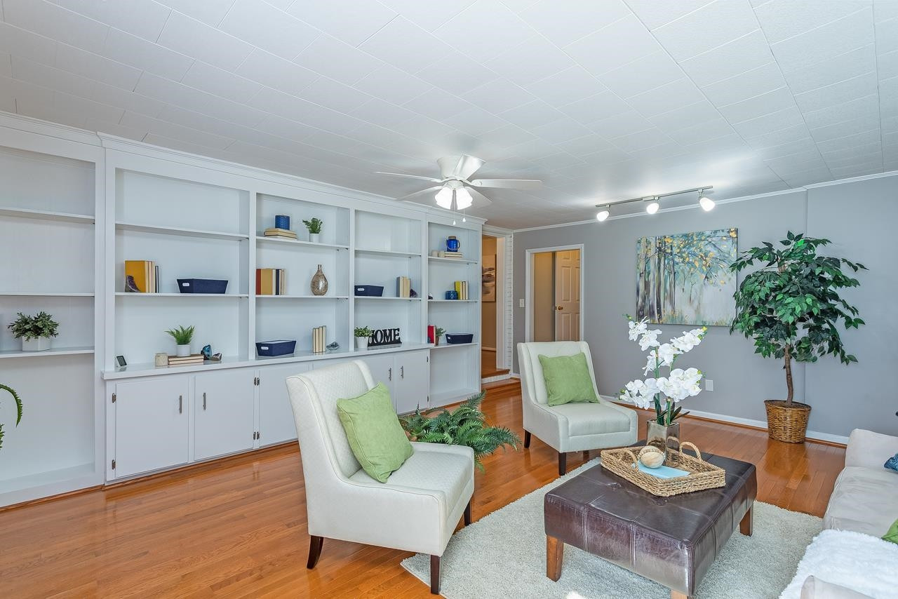 5104 Newcastle Road Raleigh, NC 27606 - Photo 14 of 26 Wall of Built-In Bookshelves