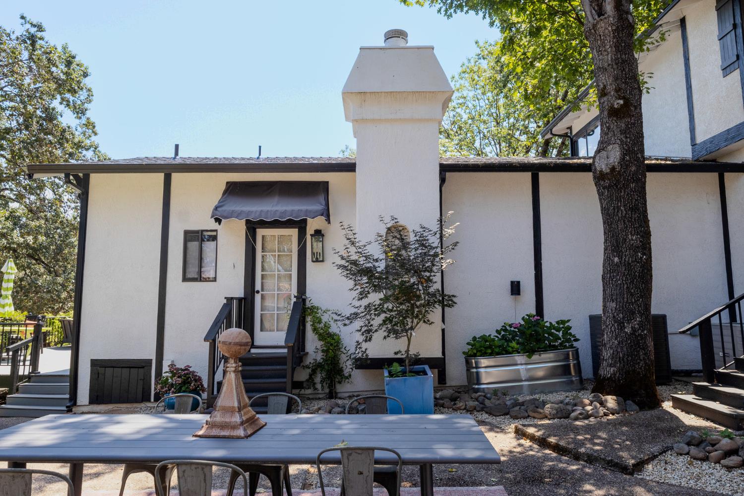 27689 Table Meadow Road Auburn, CA 95602 - Photo 57 of 72 a front view of house with outdoor seating