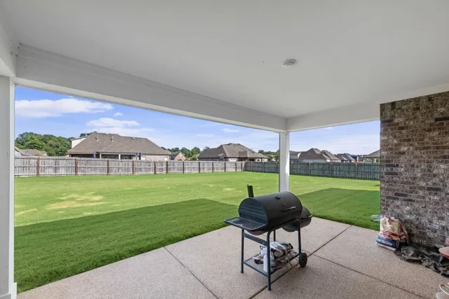 a swimming pool with outdoor seating and garden