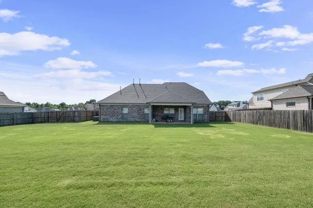 a house with garden in front of it