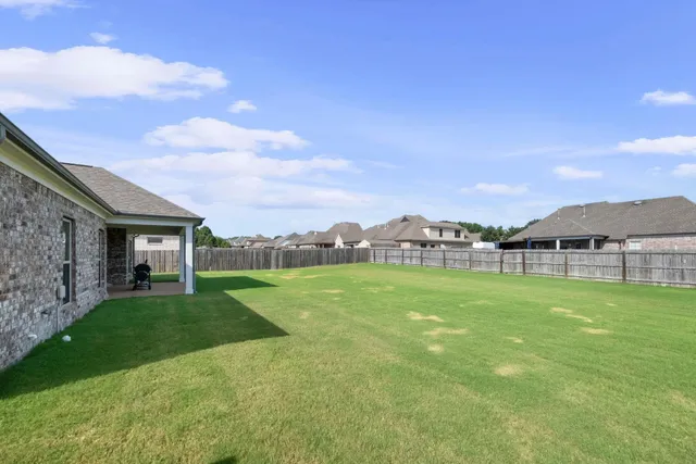 a view of a house with a big yard