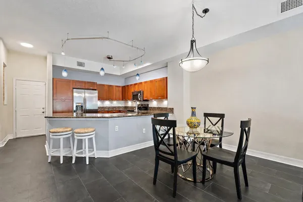 a view of a dining room with furniture and wooden floor