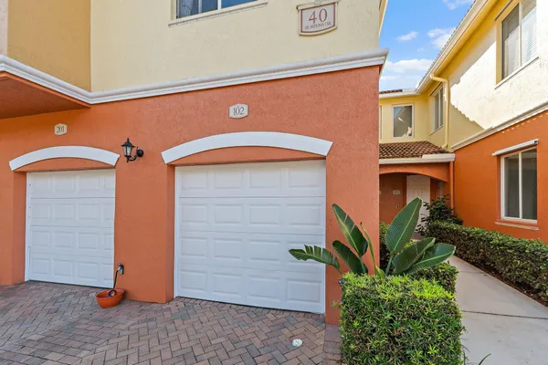 a front view of a house with a garage