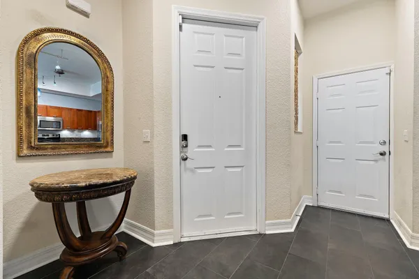 a kitchen with stainless steel appliances granite countertop a refrigerator stove and microwave