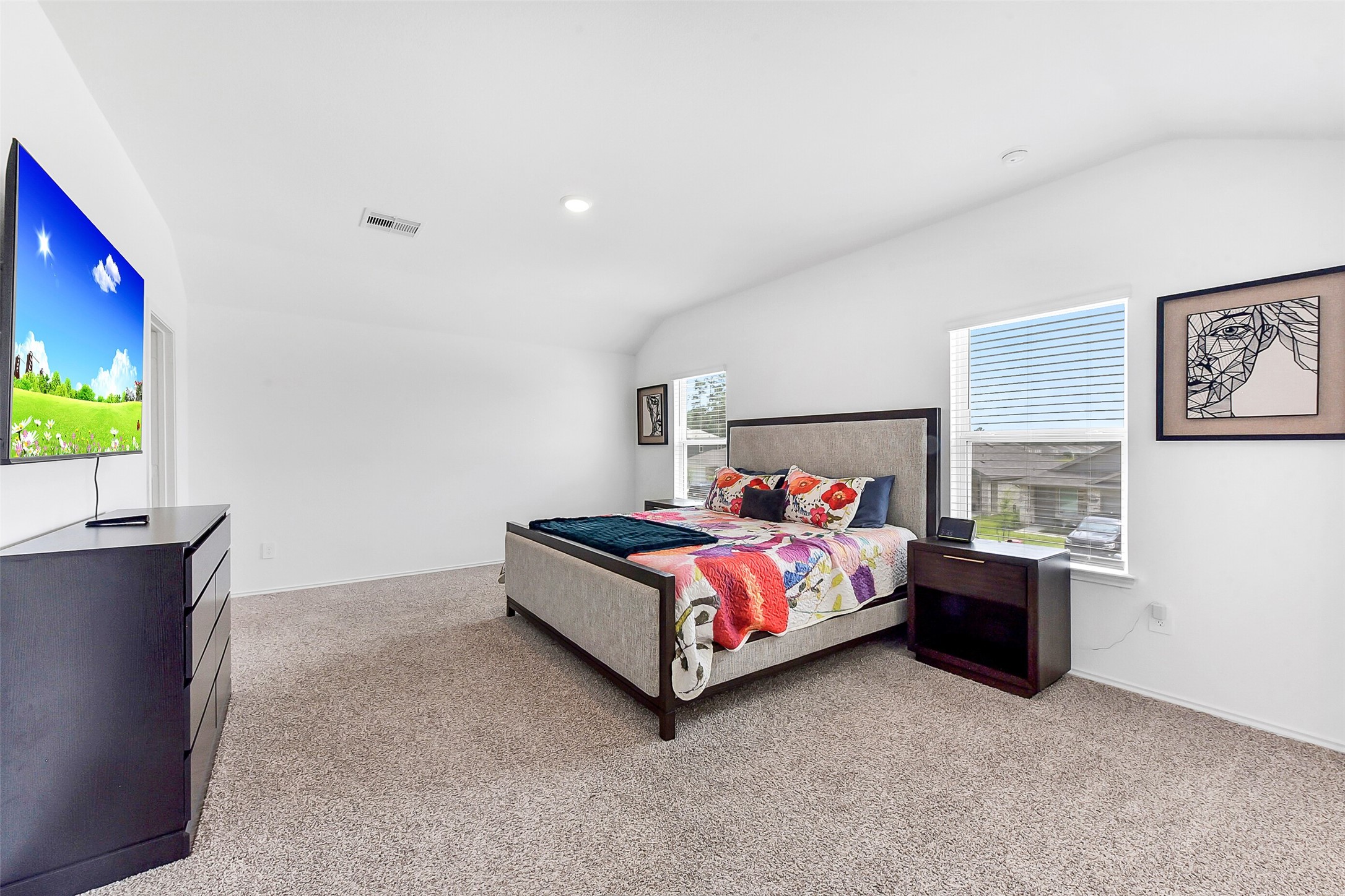 24222 Sandstone Valley Ln Spring Spring, TX 77373 - Photo 16 of 32 a bed sitting in a bedroom next to a window