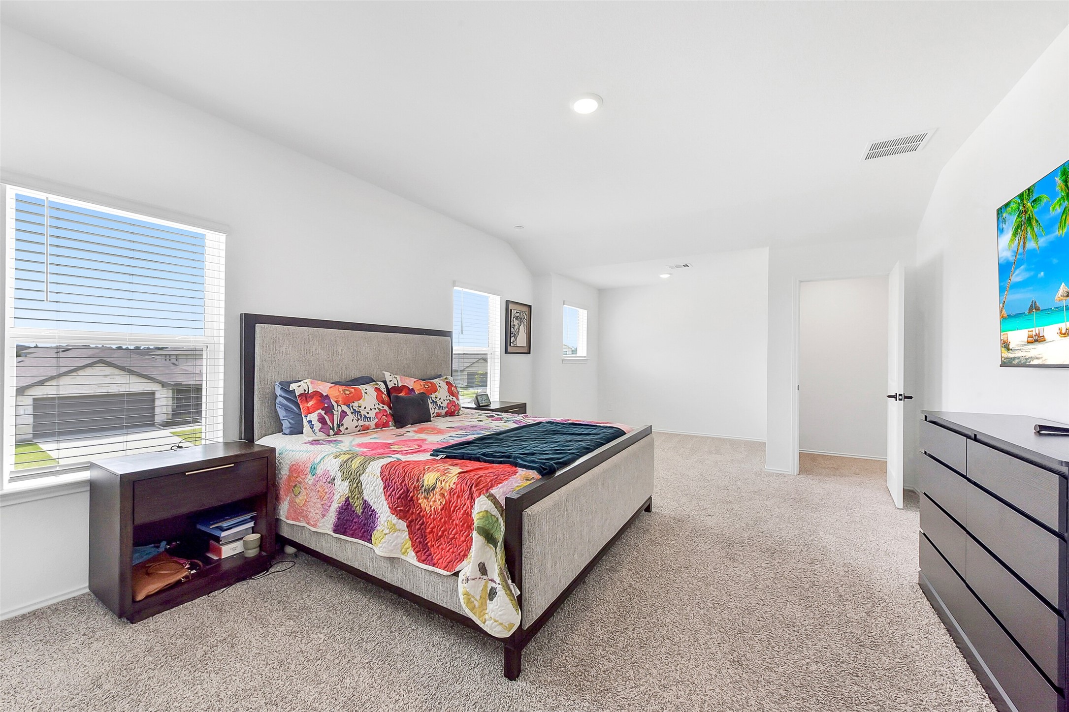 24222 Sandstone Valley Ln Spring Spring, TX 77373 - Photo 17 of 32 a bedroom with a bed and a window