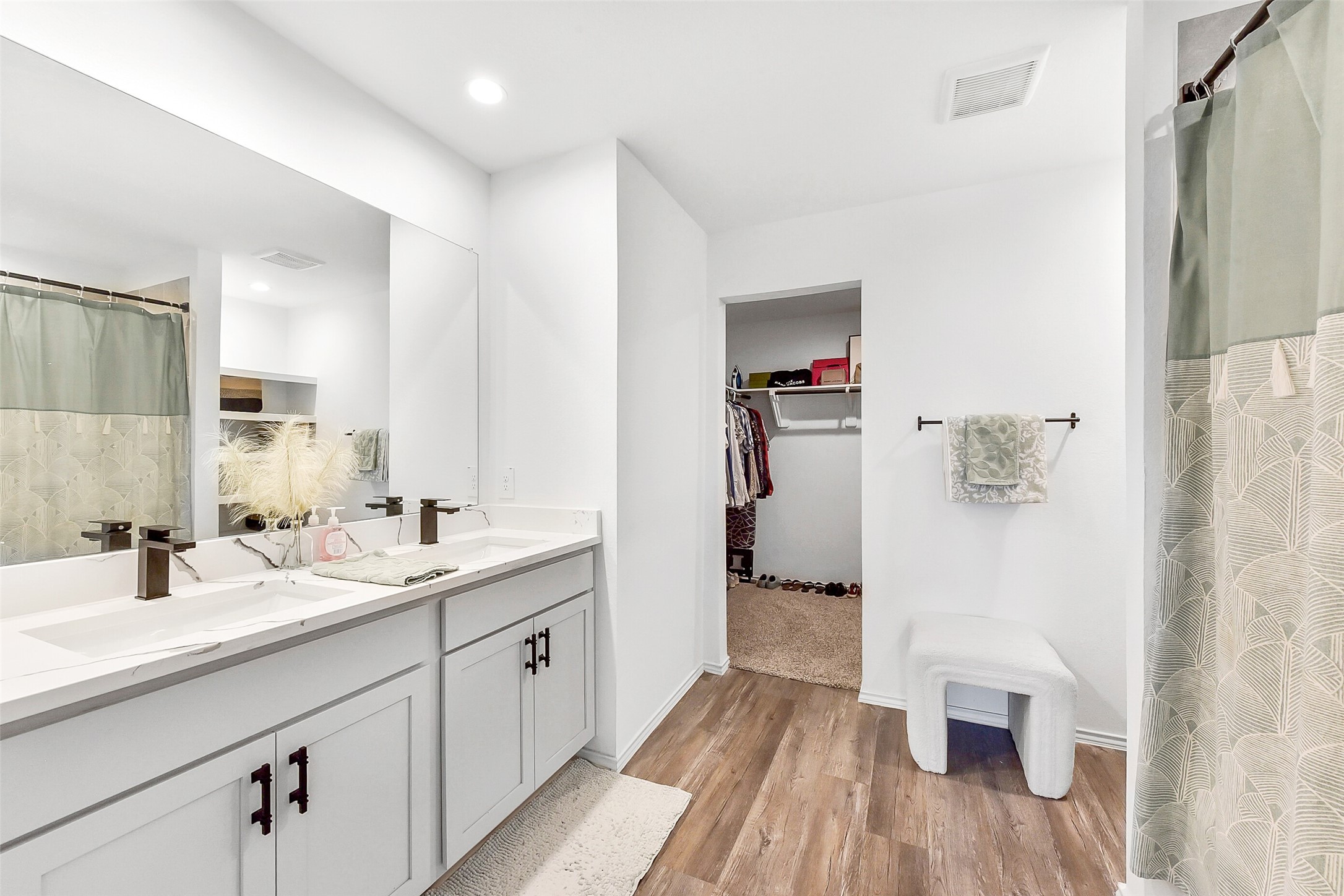 24222 Sandstone Valley Ln Spring Spring, TX 77373 - Photo 18 of 32 a spacious bathroom with a double vanity sink and a mirror