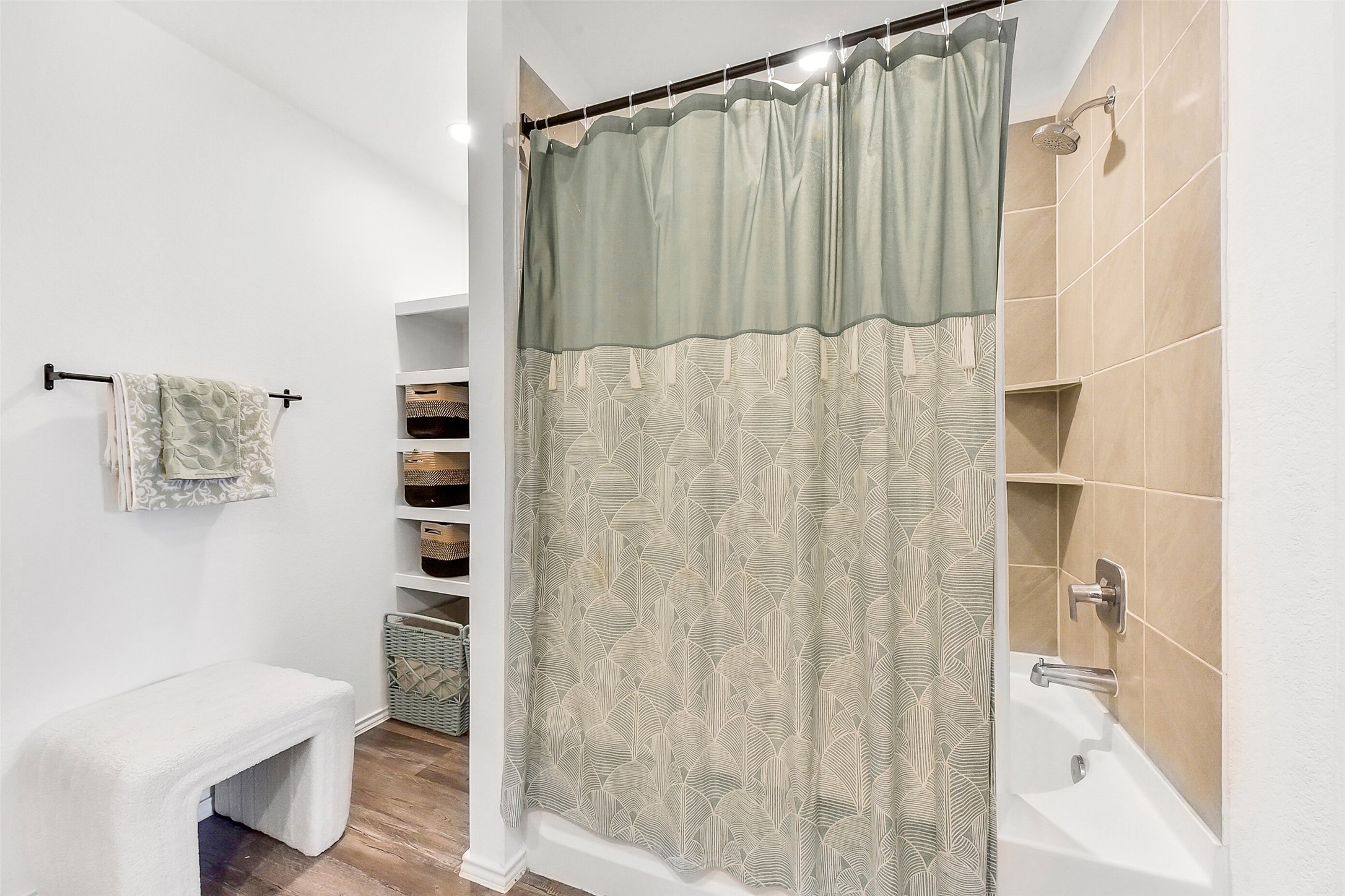 24222 Sandstone Valley Ln Spring Spring, TX 77373 - Photo 21 of 32 a bathroom with a shower curtain and a sink