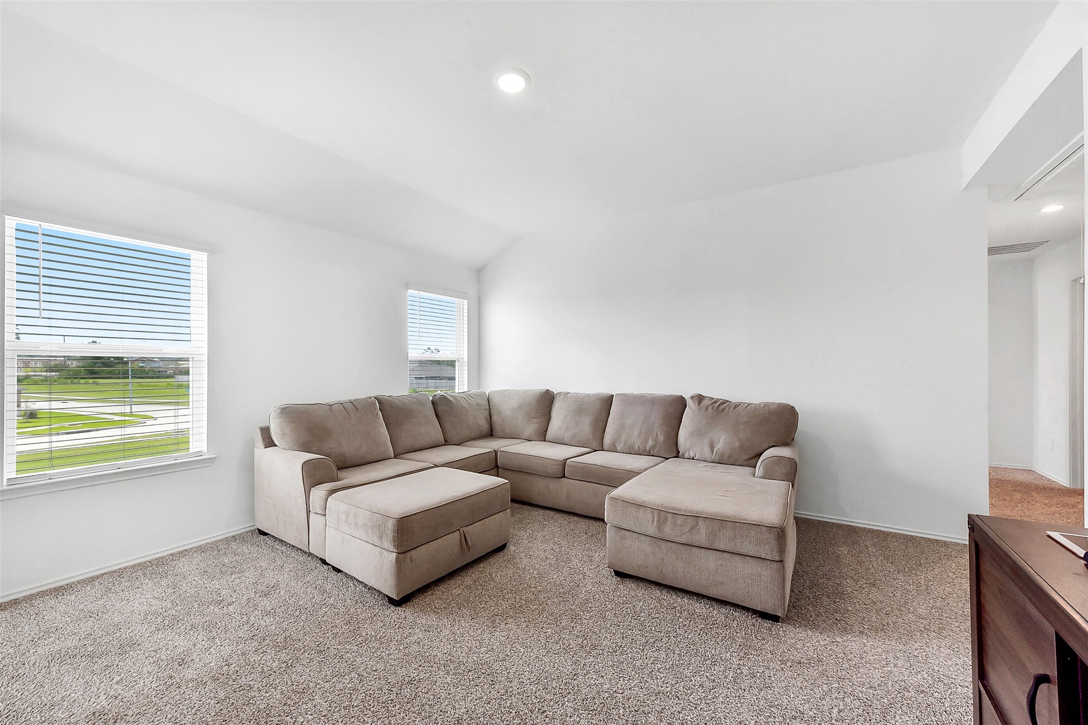 24222 Sandstone Valley Ln Spring Spring, TX 77373 - Photo 22 of 32 a living room with furniture and a window