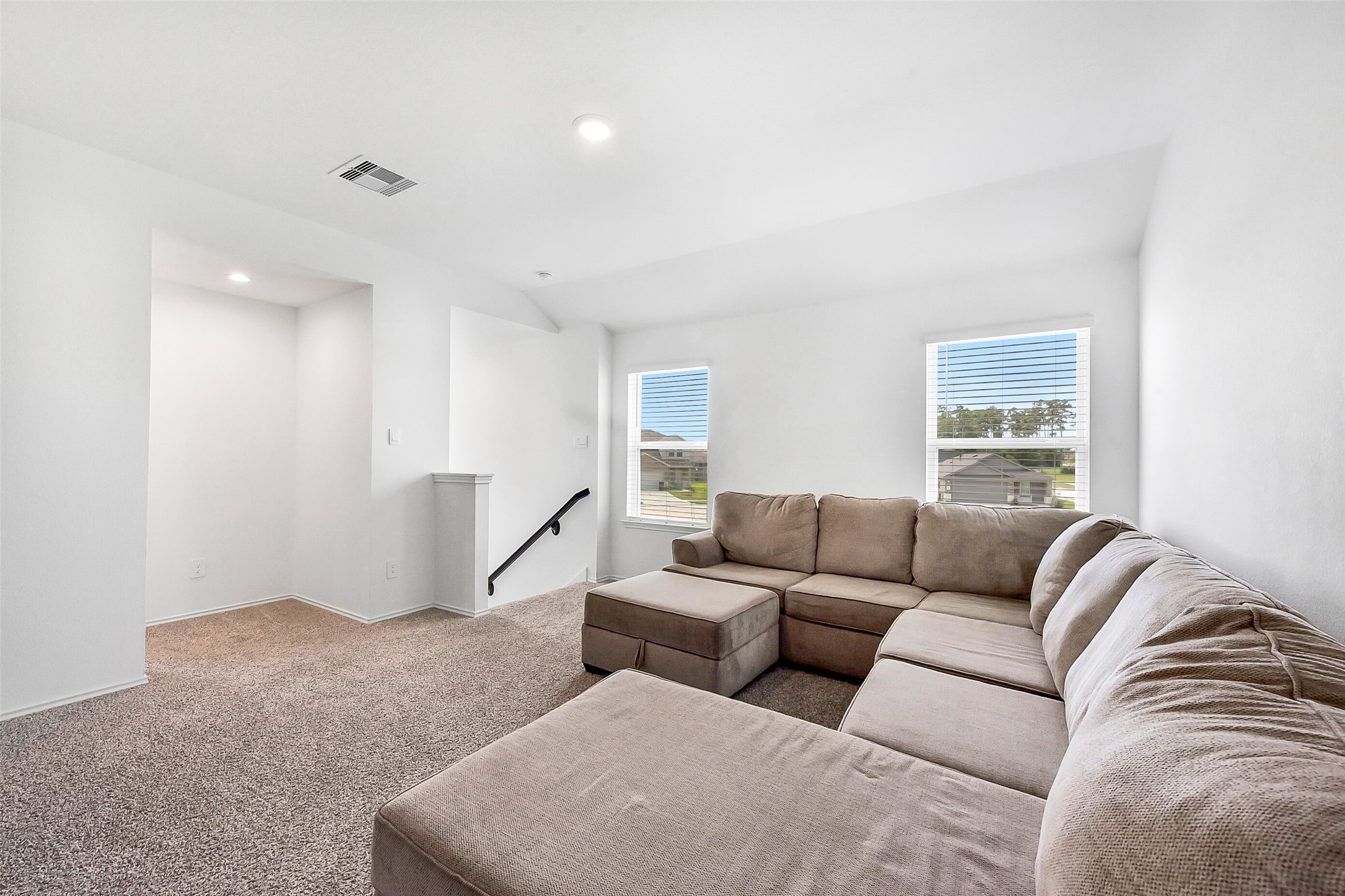 24222 Sandstone Valley Ln Spring Spring, TX 77373 - Photo 23 of 32 a living room with furniture and a window