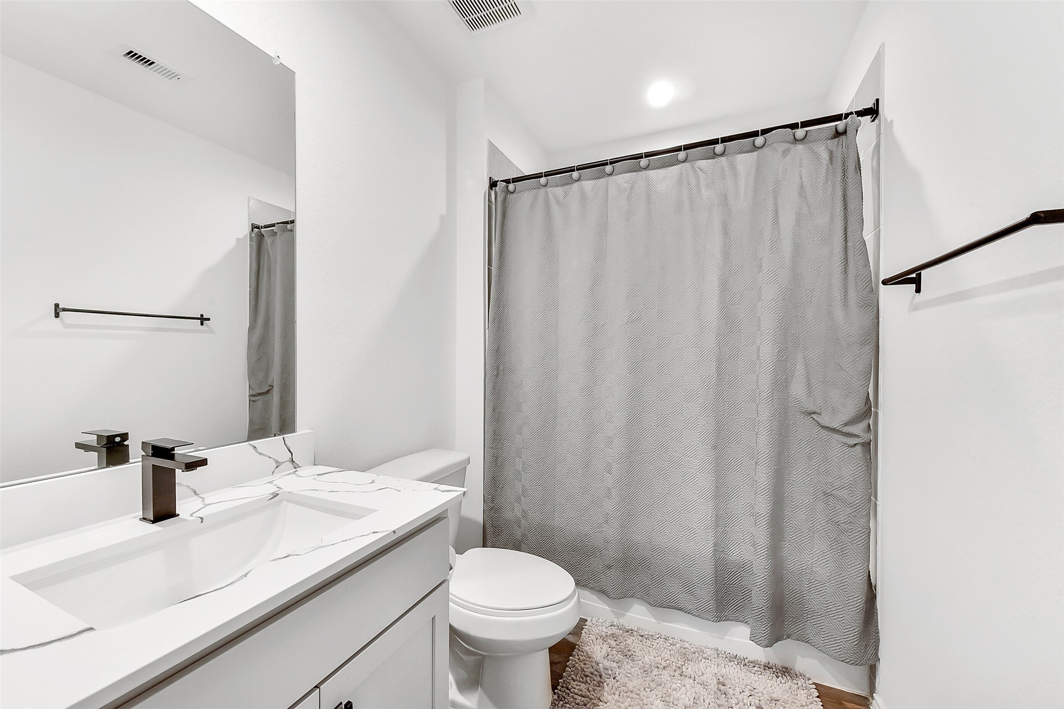 24222 Sandstone Valley Ln Spring Spring, TX 77373 - Photo 27 of 32 a bathroom with a granite countertop sink toilet and a mirror