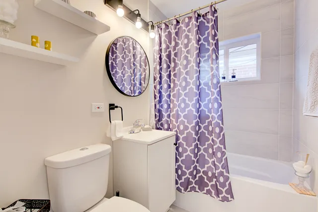 a bathroom with a toilet and a sink