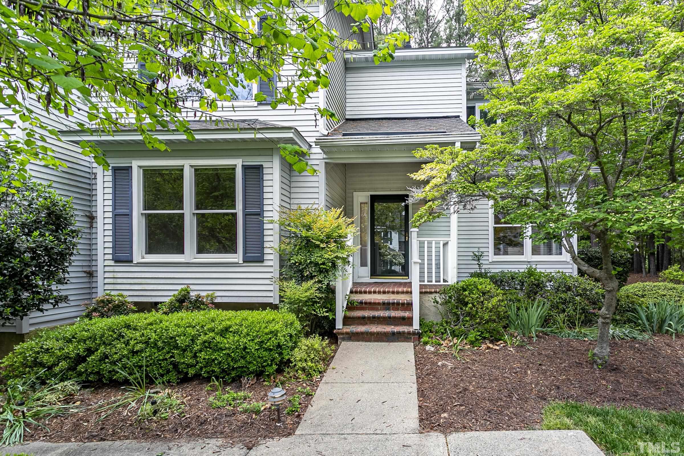 547 Weathersfield Pittsboro, NC 27312 - Photo 2 of 37 a view of a house with potted plants and a large tree