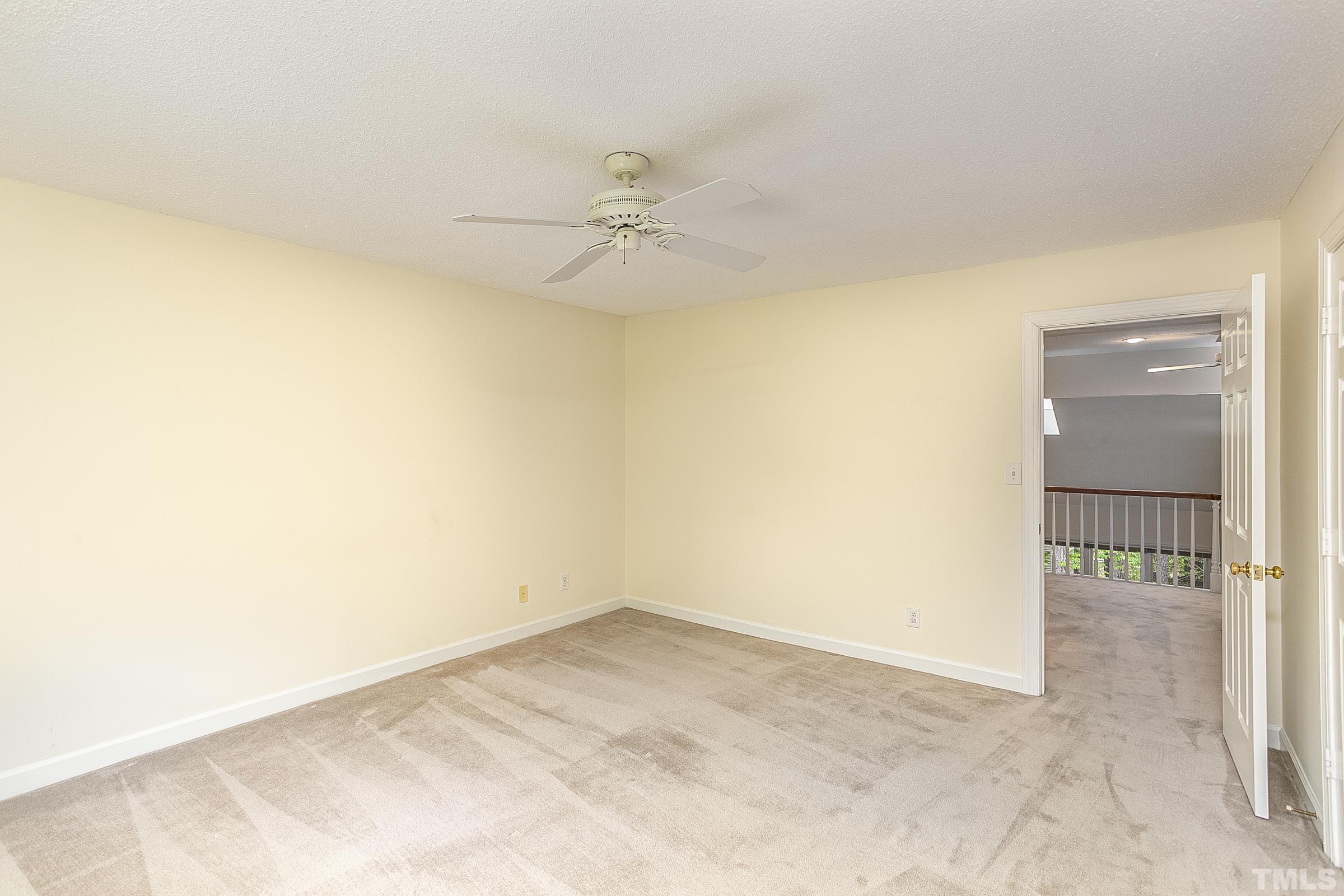 547 Weathersfield Pittsboro, NC 27312 - Photo 21 of 37 an empty room with a ceiling fan and a window