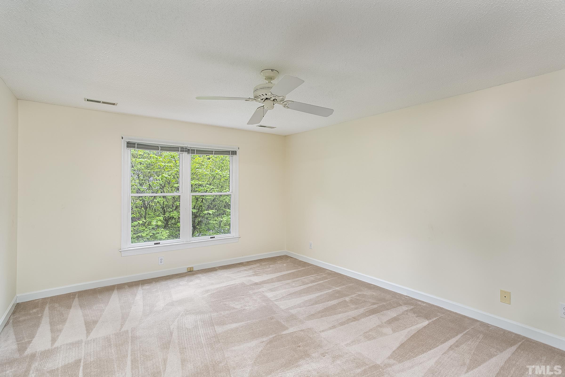 547 Weathersfield Pittsboro, NC 27312 - Photo 22 of 37 an empty room with a window and a fan