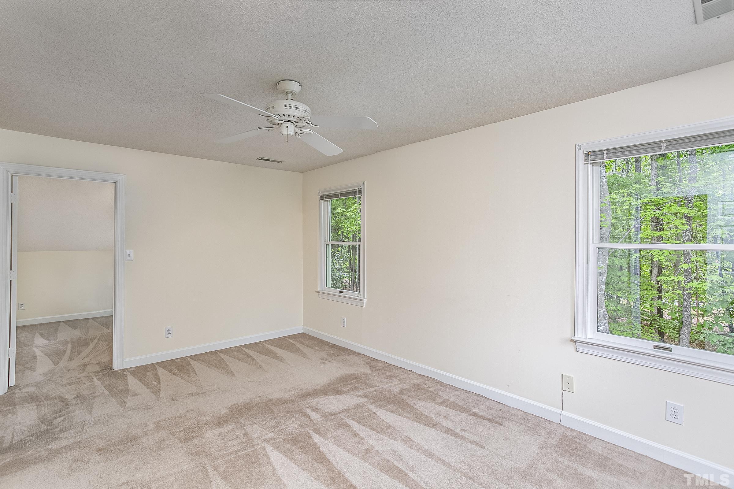 547 Weathersfield Pittsboro, NC 27312 - Photo 26 of 37 wooden floor in an empty room with a window