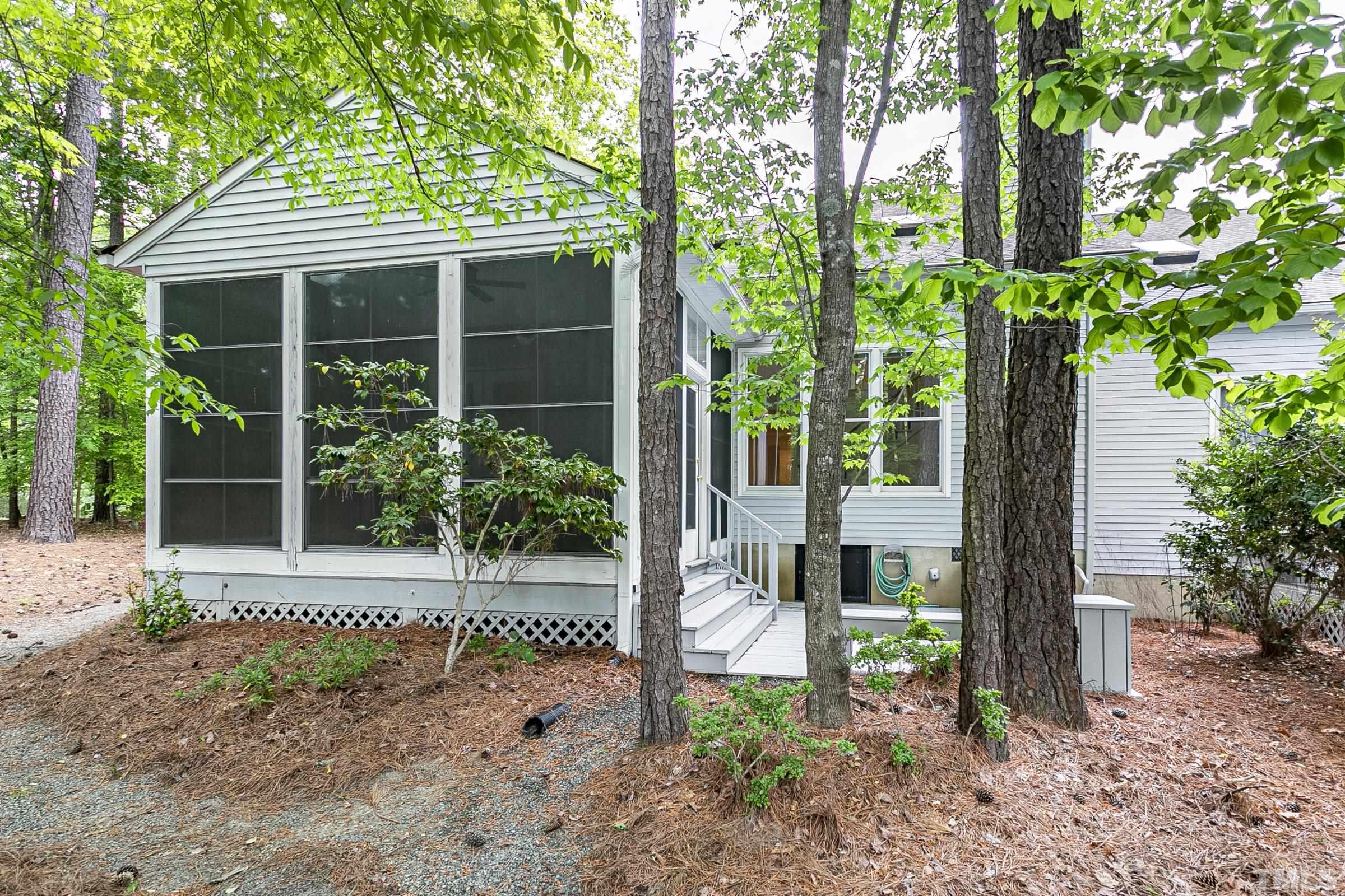 547 Weathersfield Pittsboro, NC 27312 - Photo 35 of 37 a view of a house with a garden