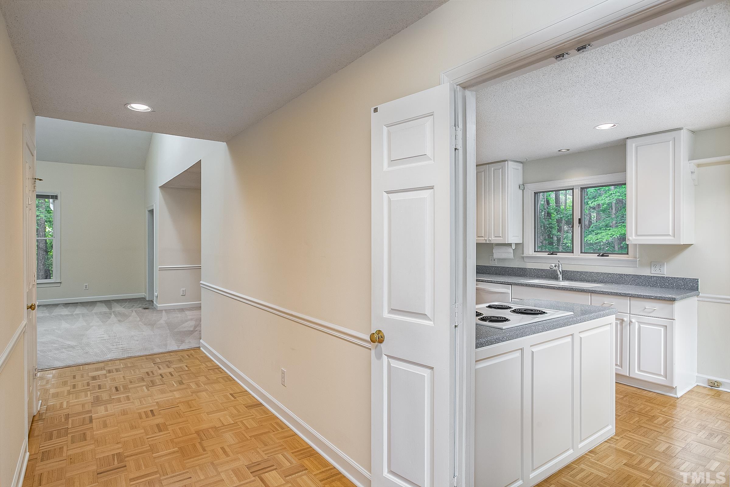 547 Weathersfield Pittsboro, NC 27312 - Photo 4 of 37 a kitchen with white cabinets and appliances
