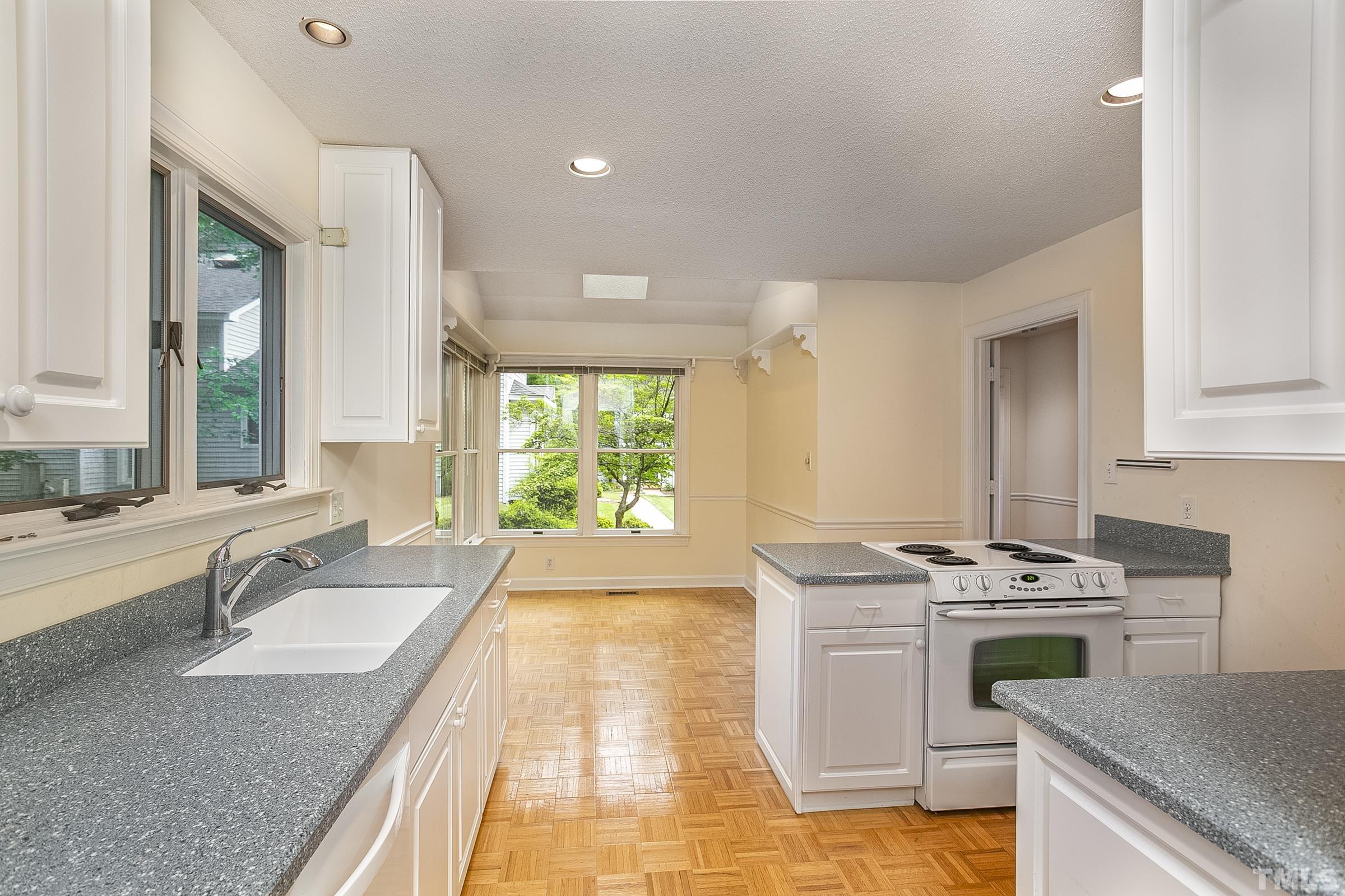 547 Weathersfield Pittsboro, NC 27312 - Photo 6 of 37 a kitchen with a stove sink and cabinets