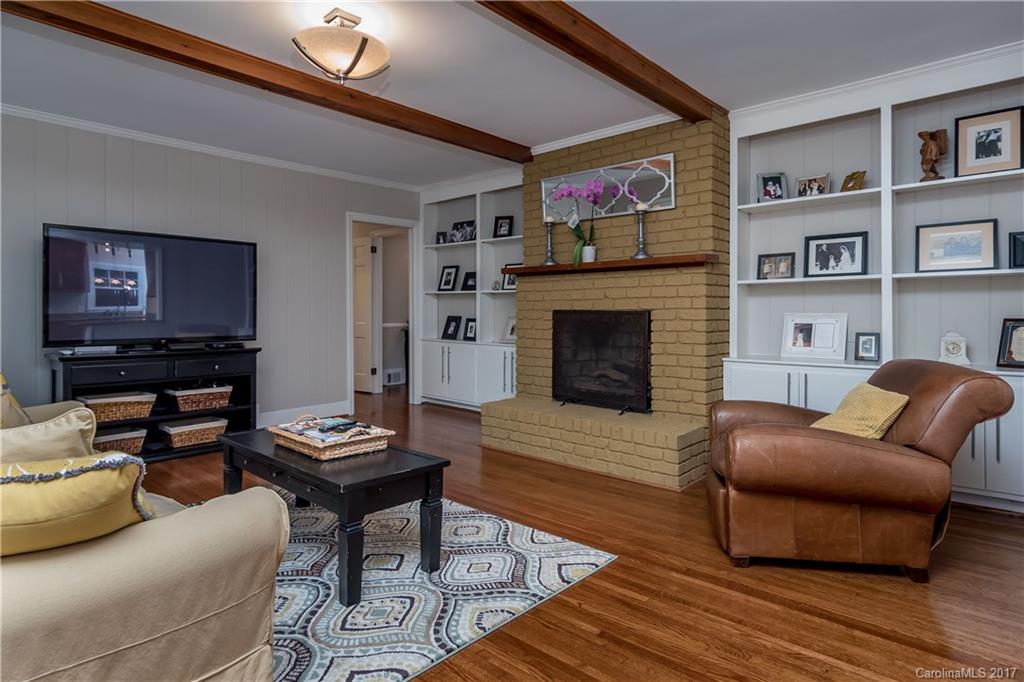 4749 Gaynor Road Charlotte, NC 28211 - Photo 12 of 24 a living room with furniture and a fireplace
