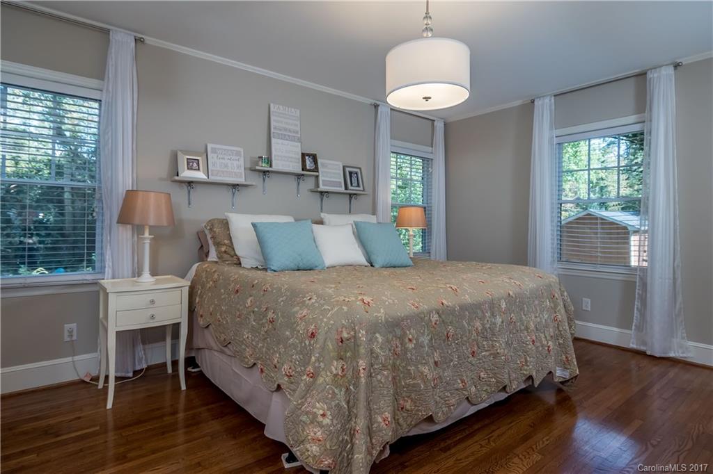 4749 Gaynor Road Charlotte, NC 28211 - Photo 15 of 24 a bed sitting in a bedroom next to a window