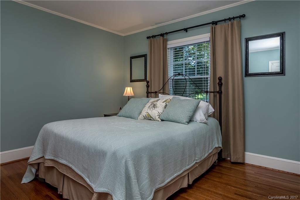 4749 Gaynor Road Charlotte, NC 28211 - Photo 19 of 24 a large bed sitting in a bedroom next to a window