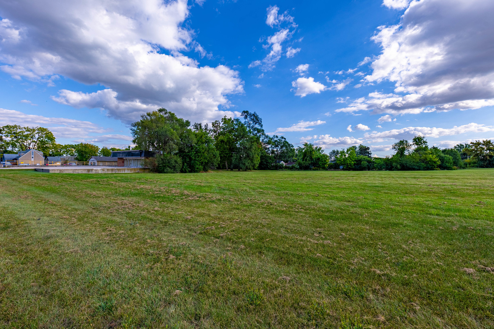 255 West Romeo Road Romeoville, IL 60446 - Photo 2 of 7 a view of a building and a big yard