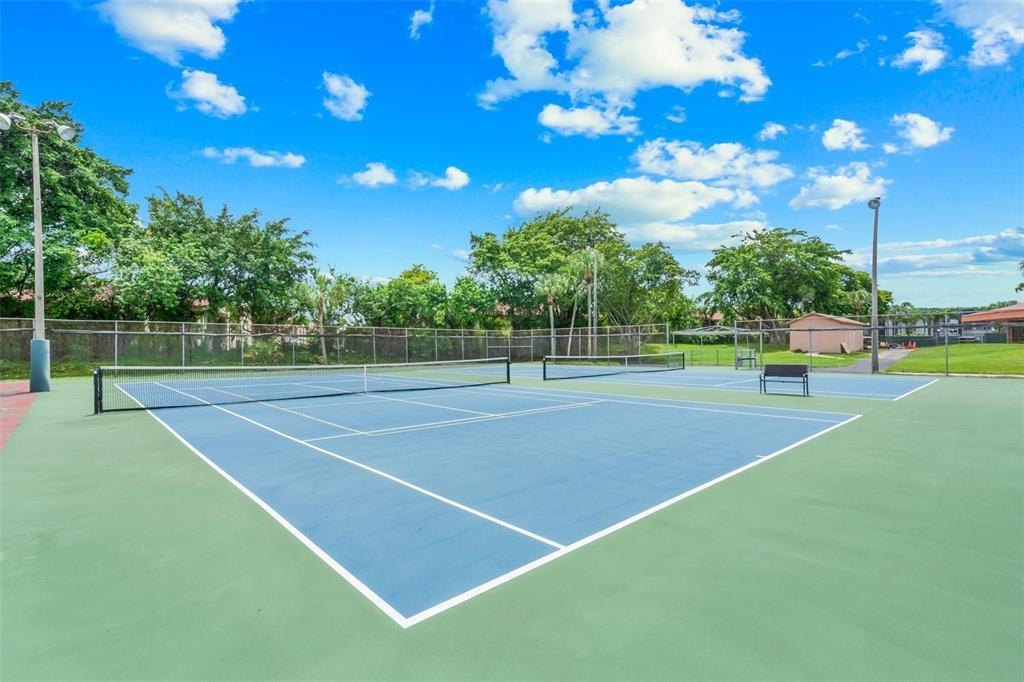3130 Holiday Springs Boulevard, Unit 104 Margate, FL 33063 - Photo 5 of 7 a view of a tennis court
